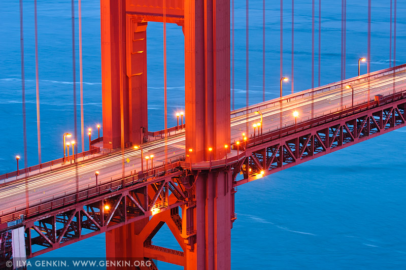 The Golden Gate Bridge tower and deck at dusk